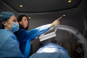 Dr. Majors and Teri in operating room